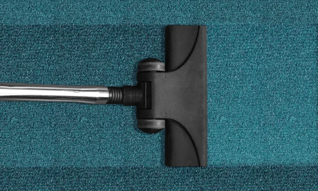 vaccuming a carpet